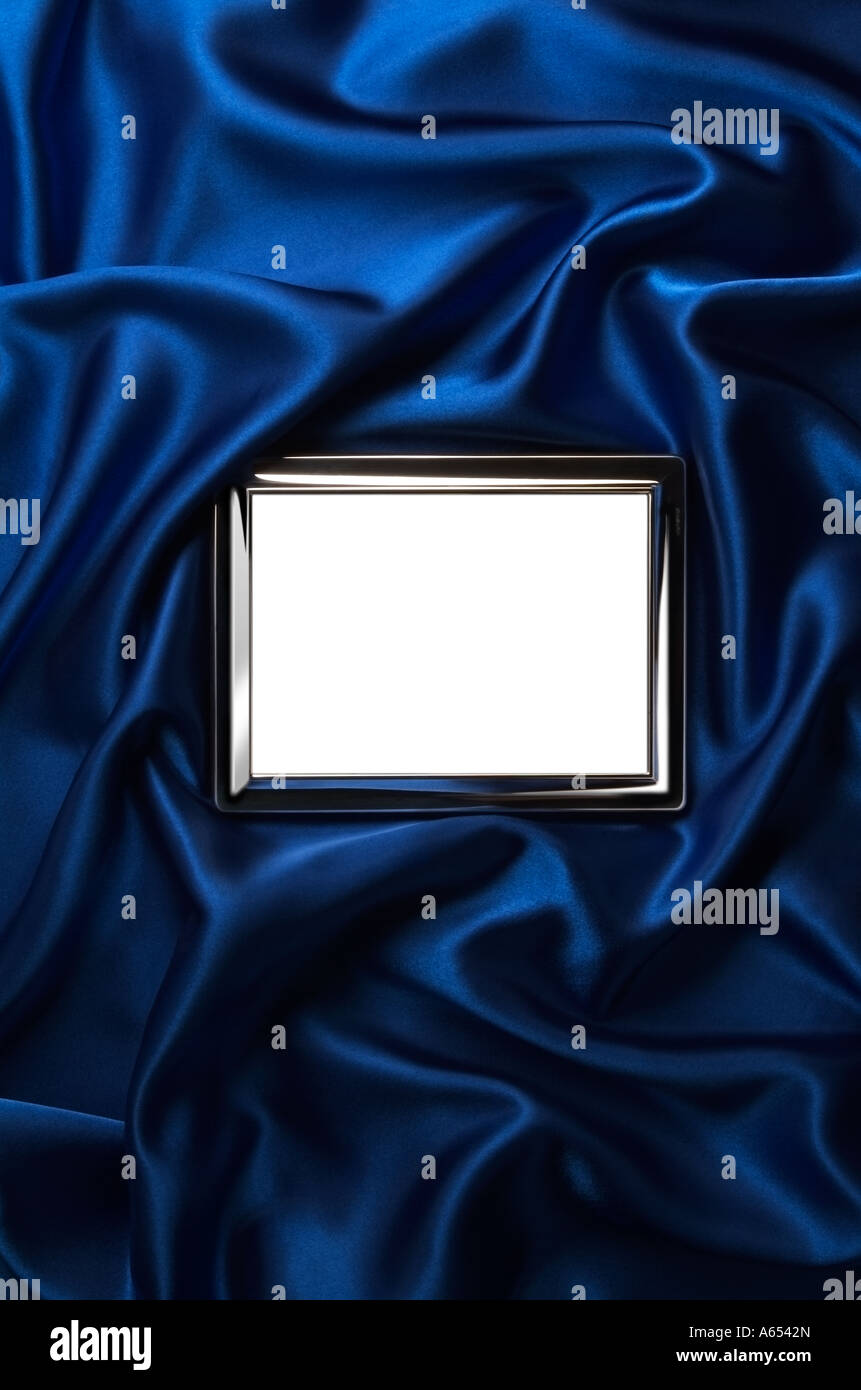 Picture Frame on blue satin background. Empty. Stock Photo