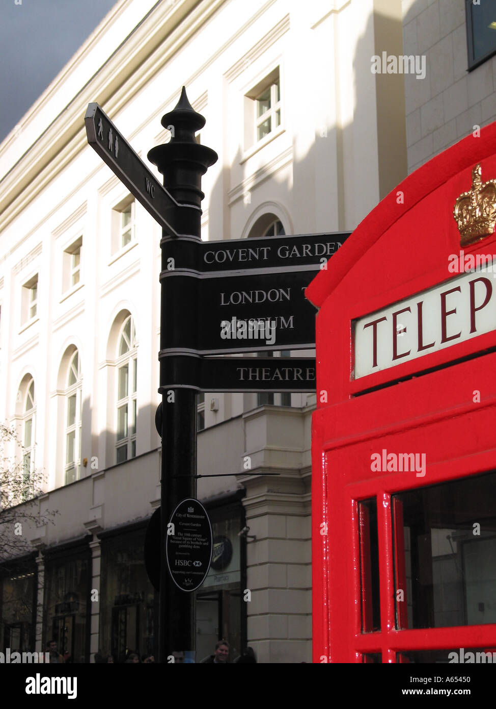 Red Telephone Box and London Tourist Signs, Covent Garden, London, England, United Kingdom Stock Photo