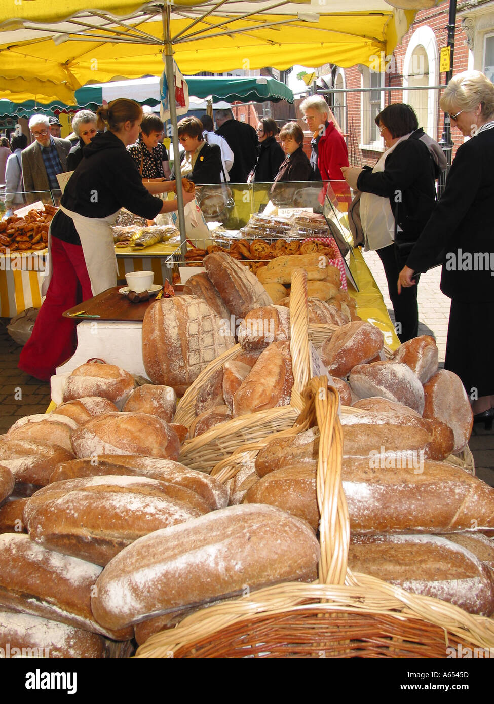 French Bakery, buying French bread, French boulangerie stall, French market, France Stock Photo