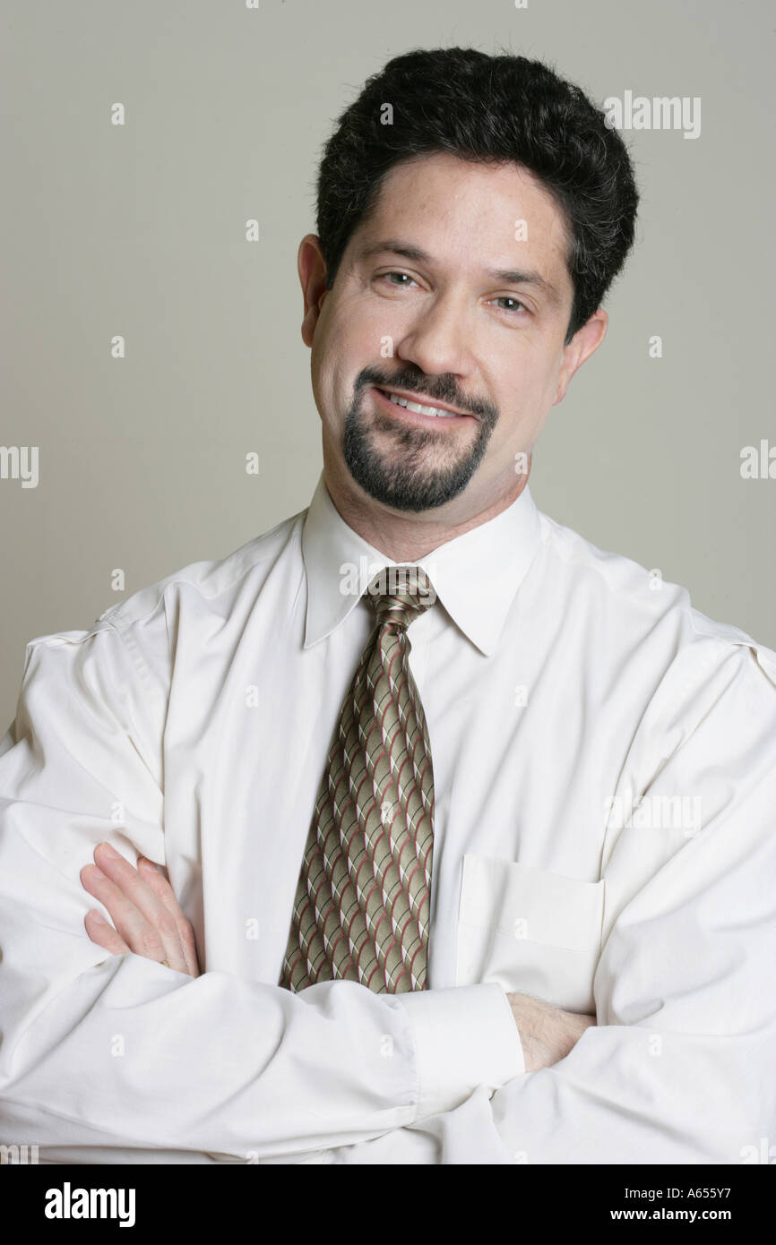 Portrait of a man wearing a white shirt and tie. Stock Photo