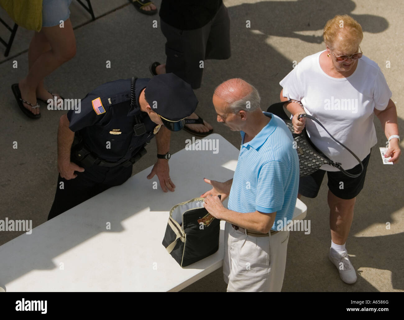 Spectators being searched by security Stock Photo