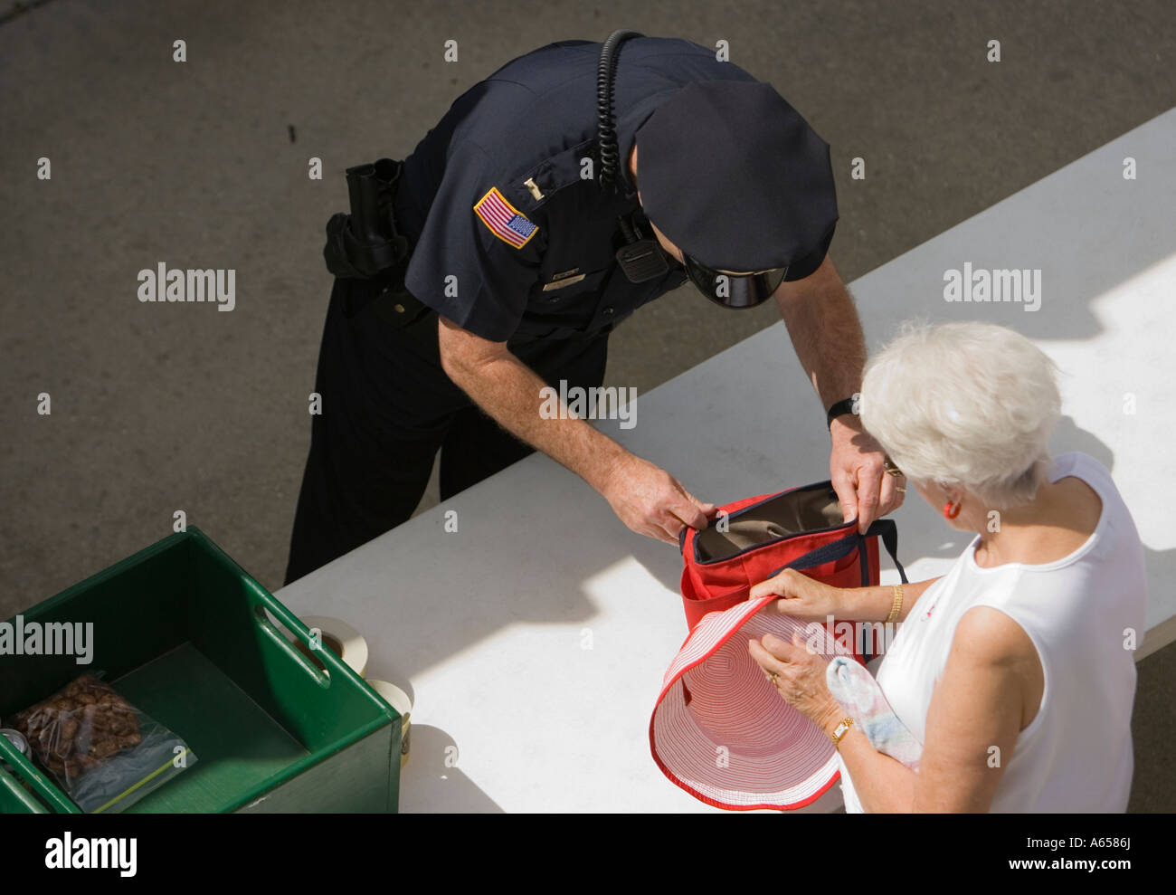 Spectators being searched by security Stock Photo