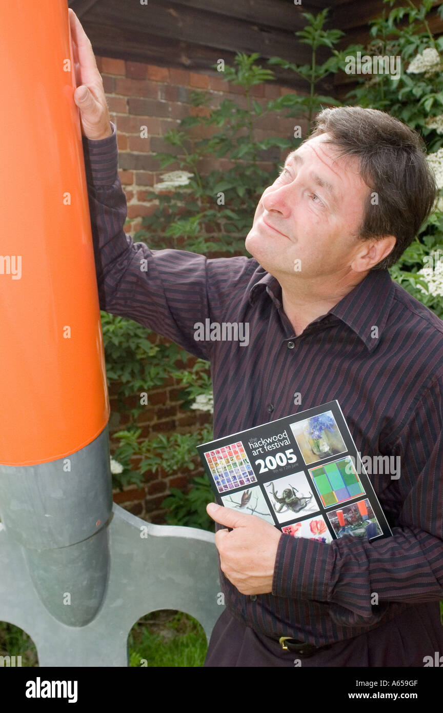 Alan Titchmarsh stands next to a giant garden fork Stock Photo
