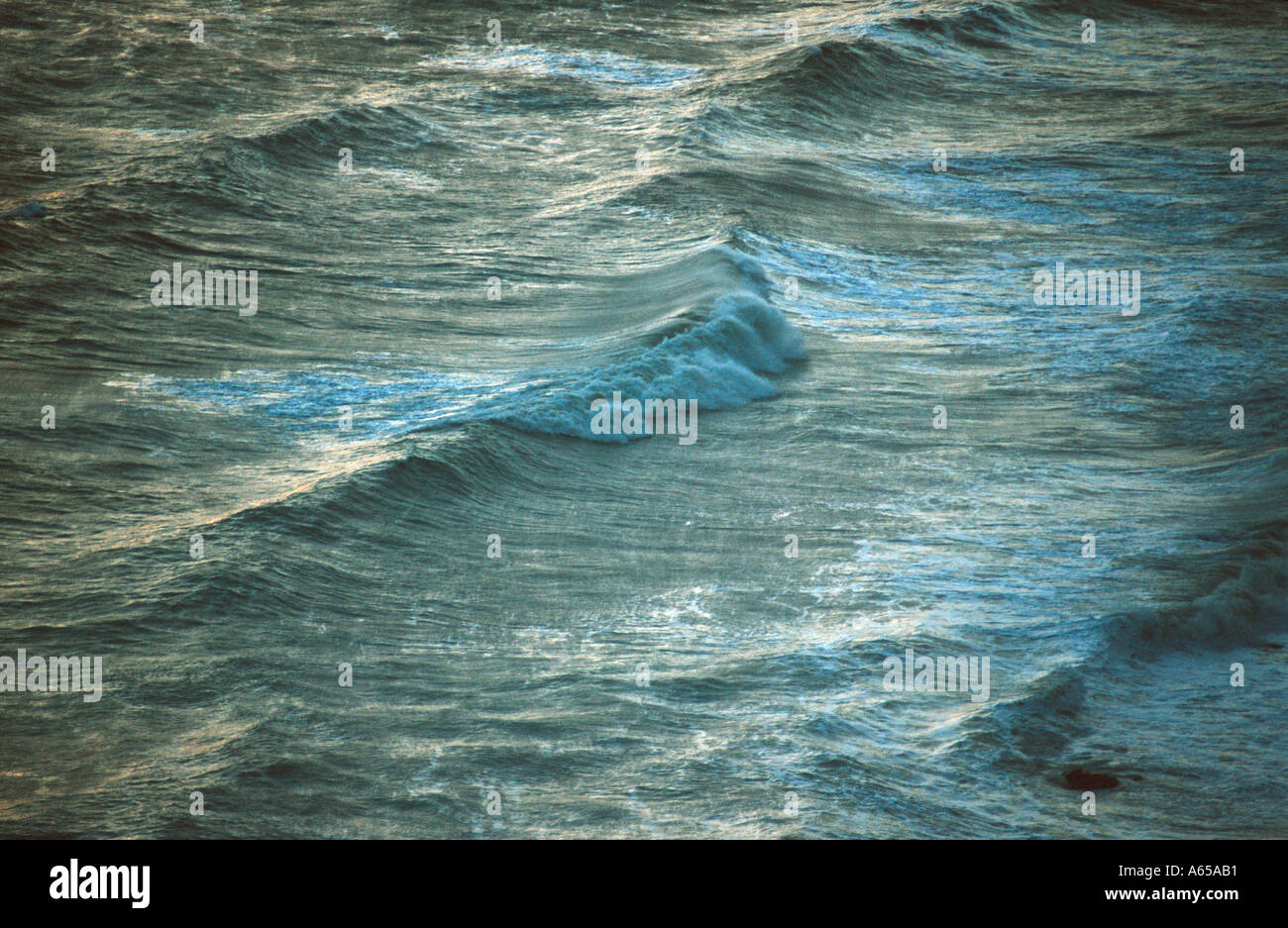 Waves in evening light hi-res stock photography and images - Alamy