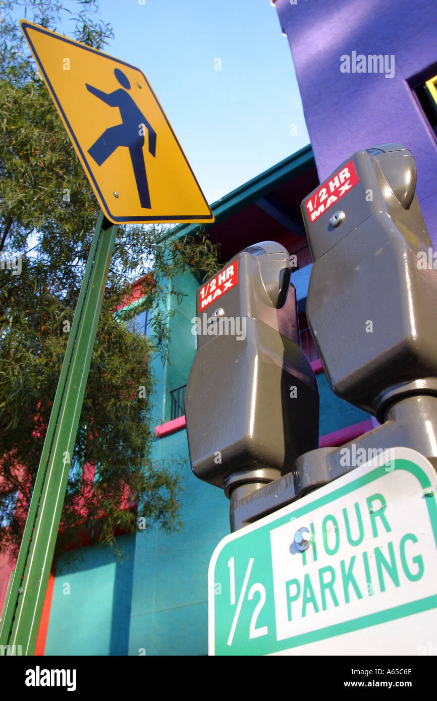 Parking meters and pedestrian crossing sign Tucson Business District