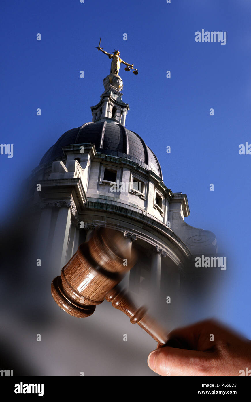 Scales of Justice Old Bailey London England with hand gavel Stock Photo