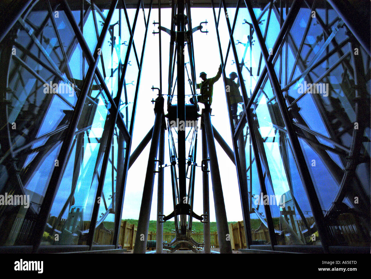 A 7 metre high glass and stainless steel water wheel at the Gaia Energy Centre in Delabole Cornwall Stock Photo