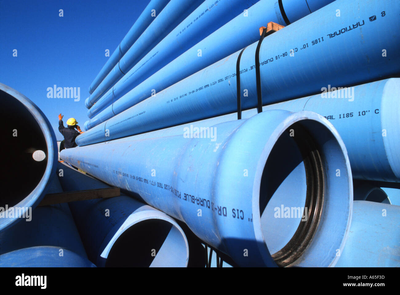 construction foreman and large sewer pipes Stock Photo Alamy