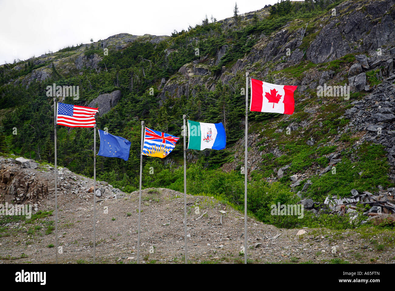 5 Flags from USA , Alaska, Yukon, British Columbia and Canada. Stock Photo