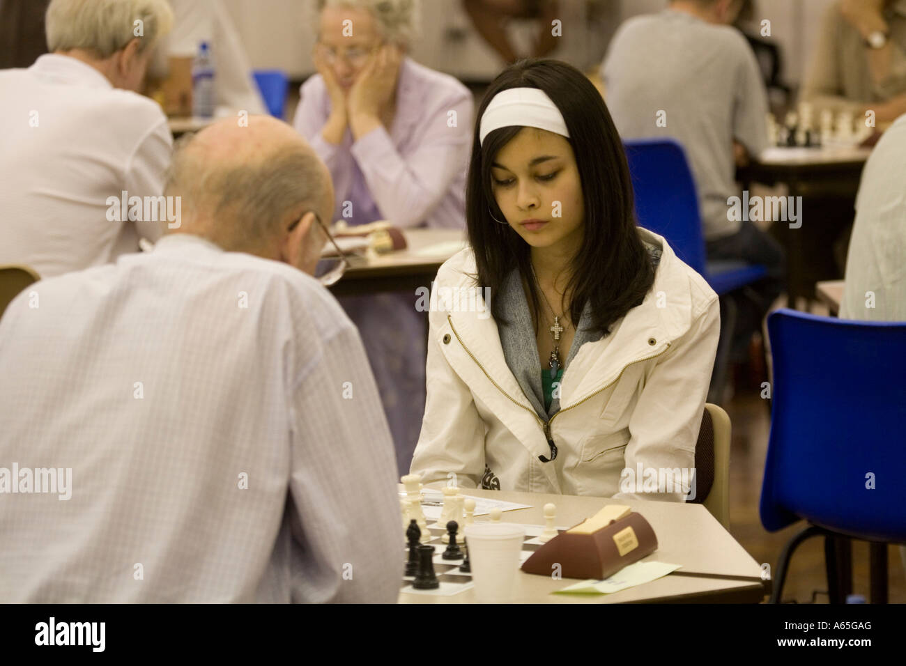 Pretty young teenage girl playing in the International Chess Tournament at Caerleon South Wales 2006 Stock Photo