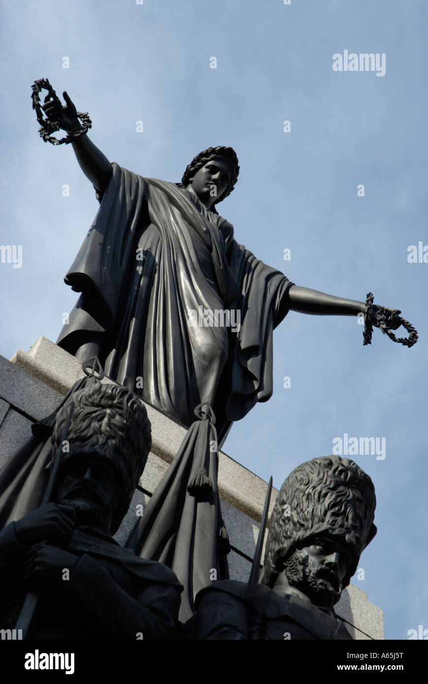 Angled view of Crimean War memorial statues in Waterloo Place London