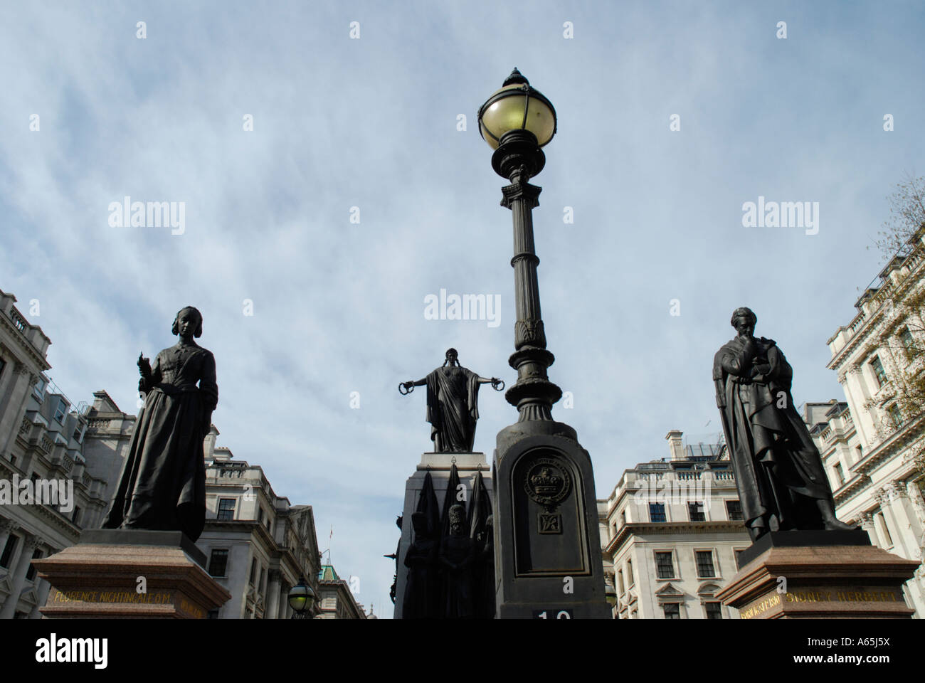 Sweeping view of Waterloo Place and Crimean War memorial statues London