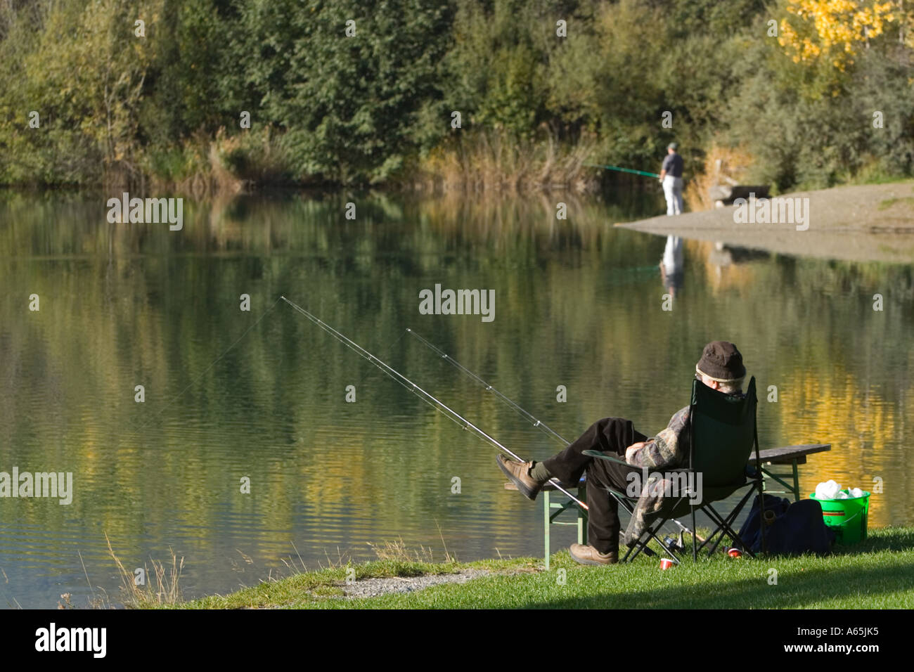 Man Fly Fishing, Sitting on Collapsible Chair Stock Photo - Image of clear,  casual: 13584756