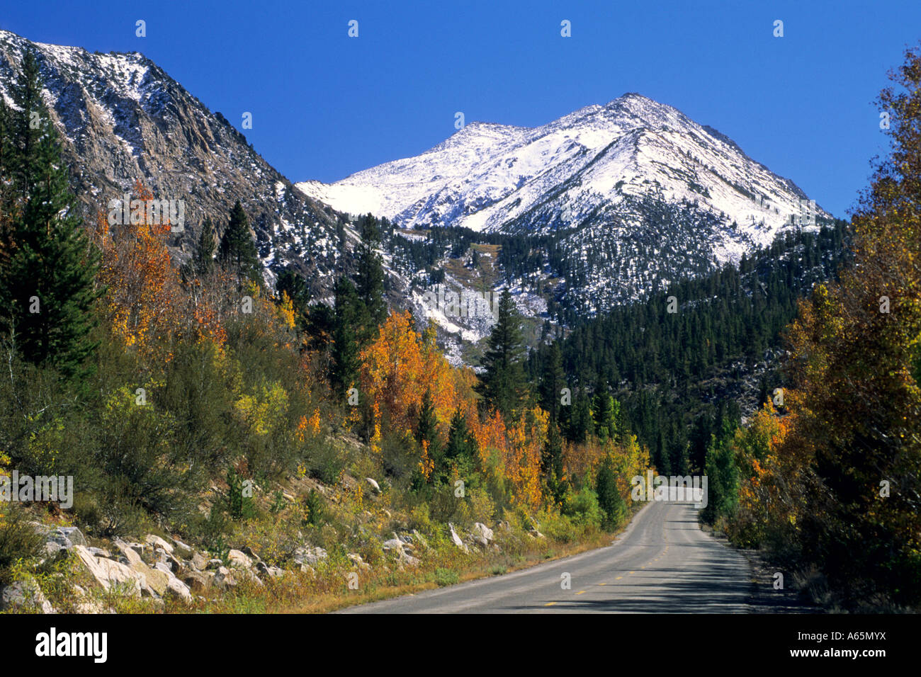 Fall snow on peaks above mountain road to South Lake Road, near