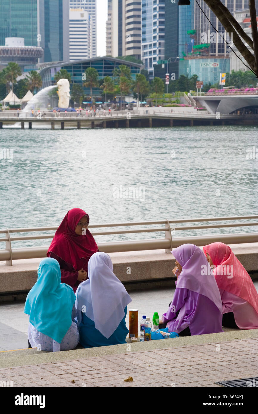 Muslim Women Enjoying a Picnic Merlion Singapore Stock Photo