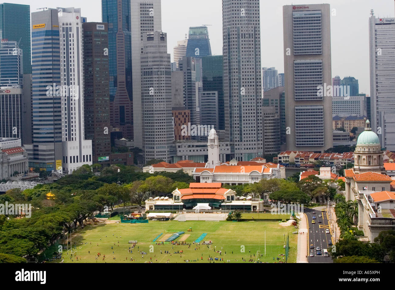 Football on the Padang Surrounded by Highrise Singapore Stock Photo
