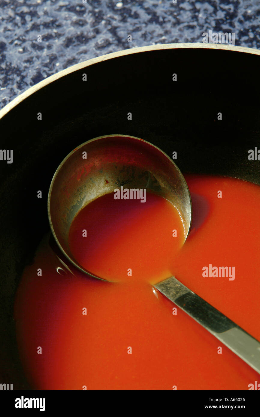 Tomato Soup With Soup Spoon Ladle Stock Photo