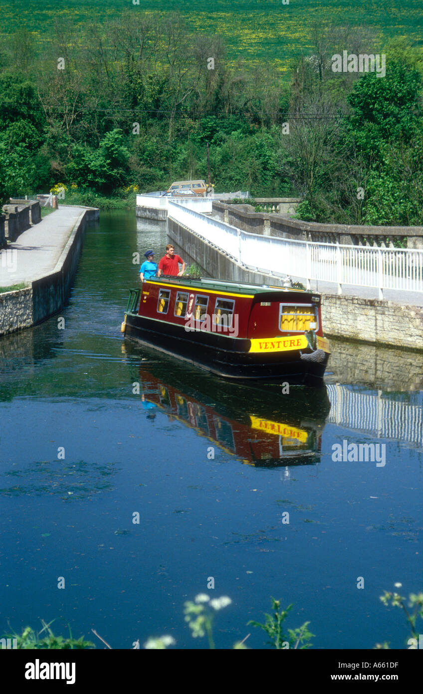 A narrowboat passes over the aqueduct at Avoncliffe on the Kennet and Avon Canal in Wiltshire England UK  Stock Photo
