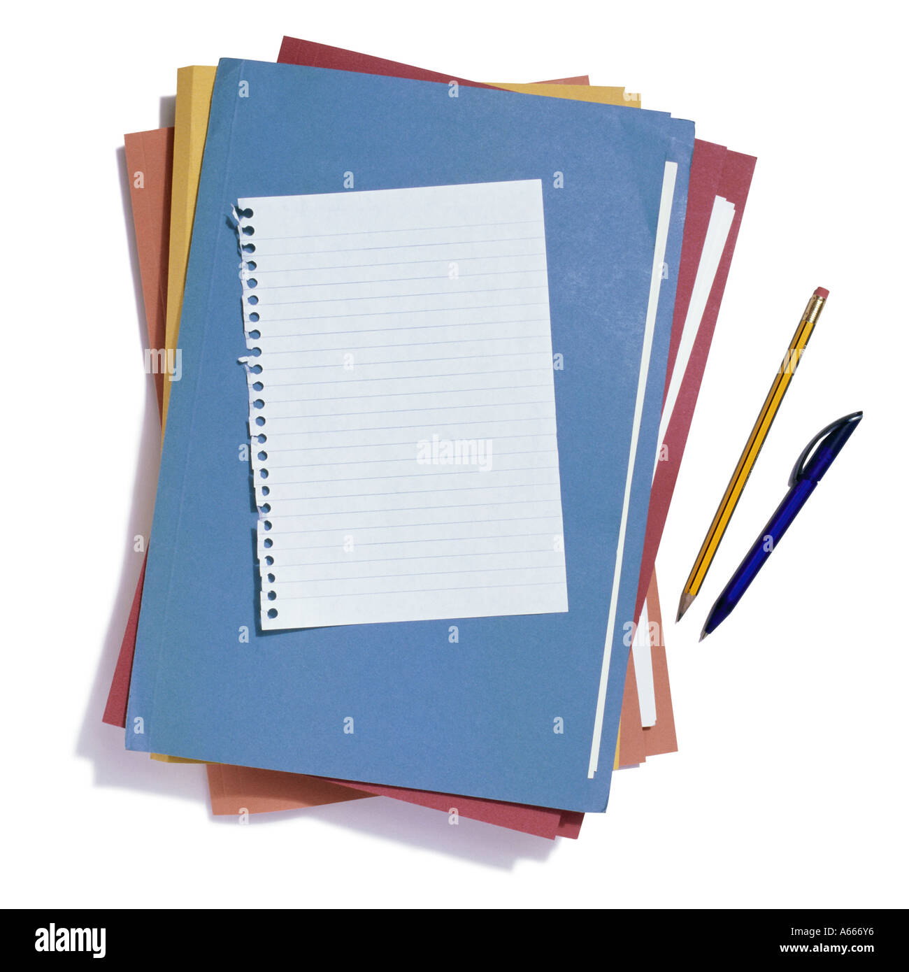 A selection of coloured folders and a sheet of lined paper Stock Photo