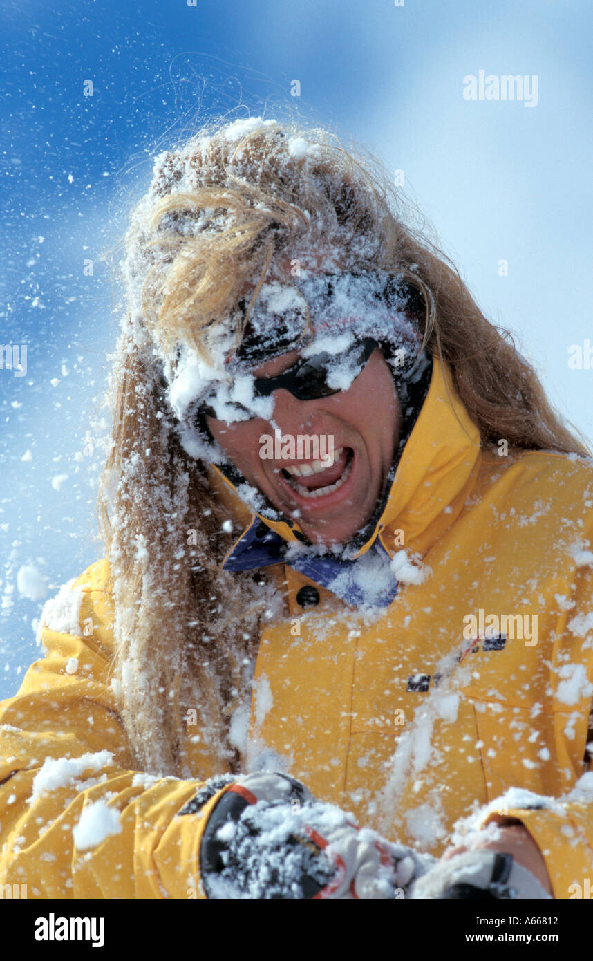 Woman in a snowball fight Stock Photo