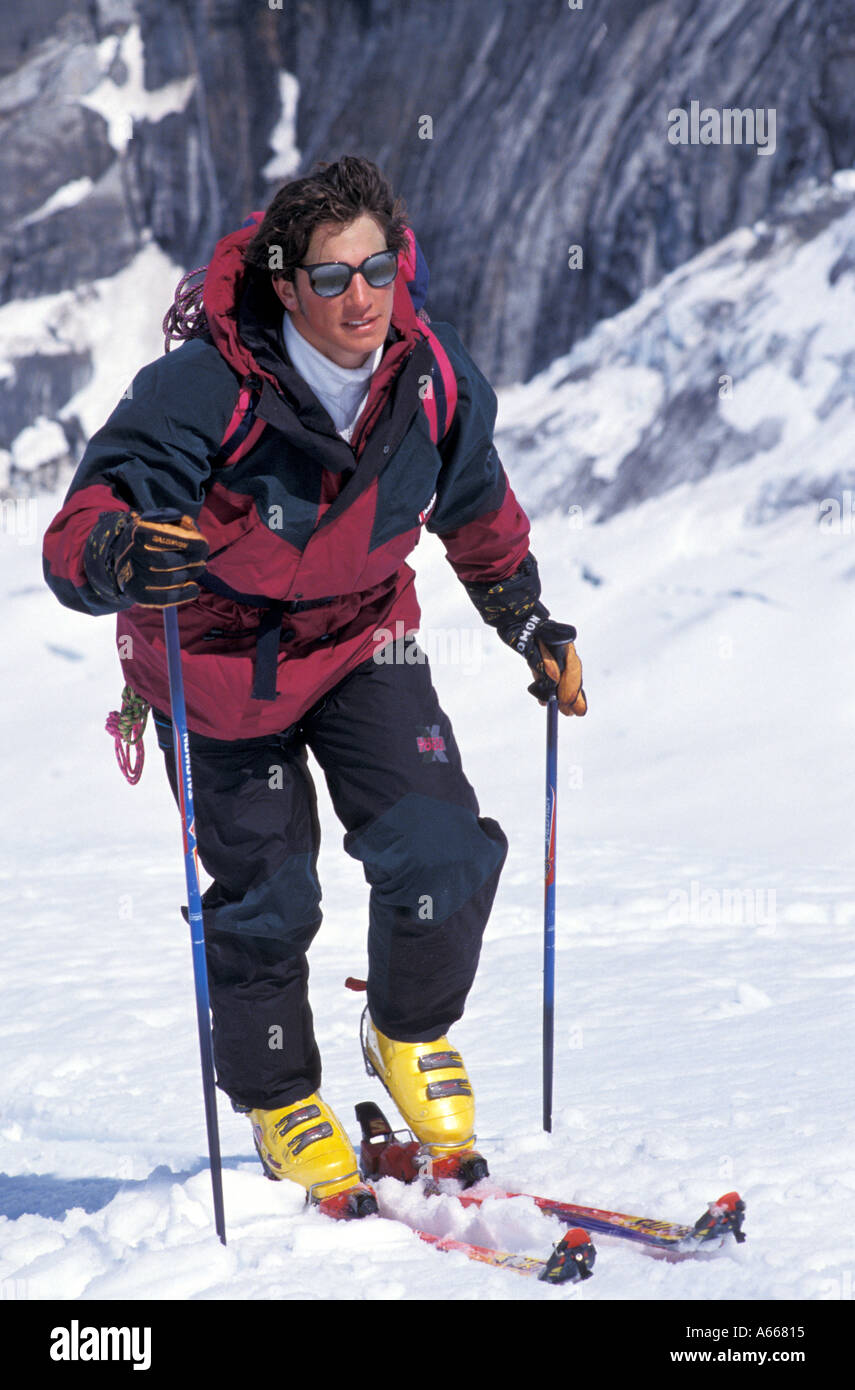 Ski tourer skinning up a mountain Stock Photo