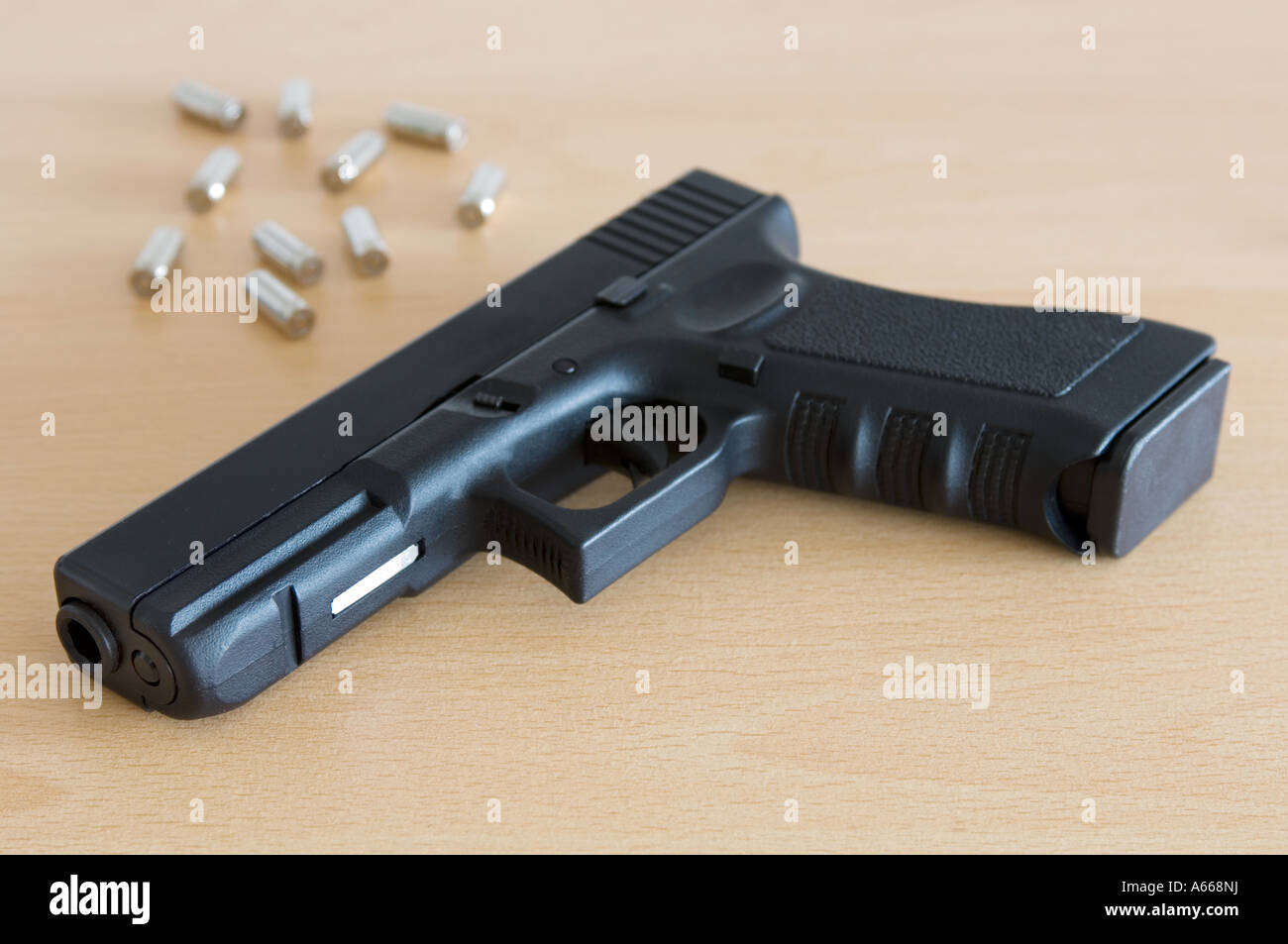 a glock automatic pistol with bullet casings (replica gun) Stock Photo