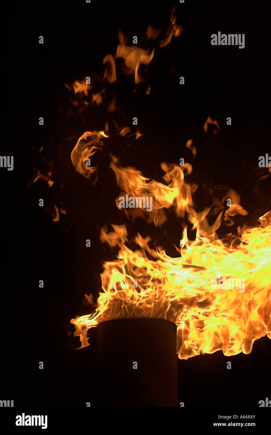 [Chimney fire], bright yellow flames leaping against black night sky, 'close up' Stock Photo