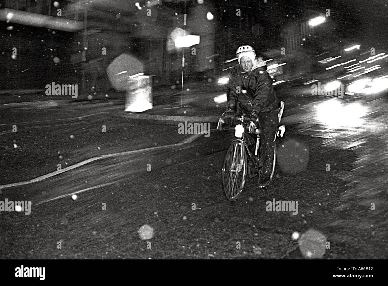Man riding under the snow London Britain England UK Stock Photo