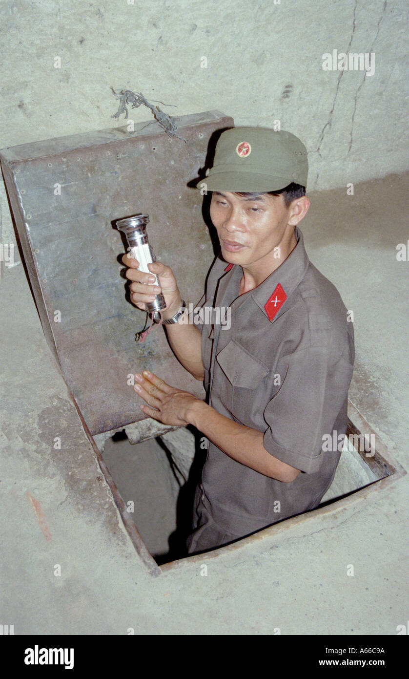 Vietnamese soldier coming out of one of the Cu Chi Tunnels in Ho Chi Minh City Vietnam Stock Photo