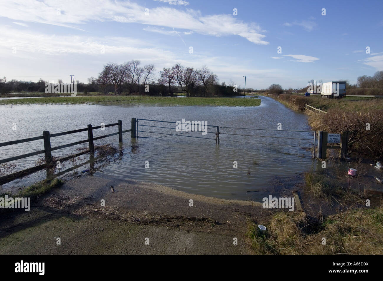 flooded entrance to farm Stock Photo