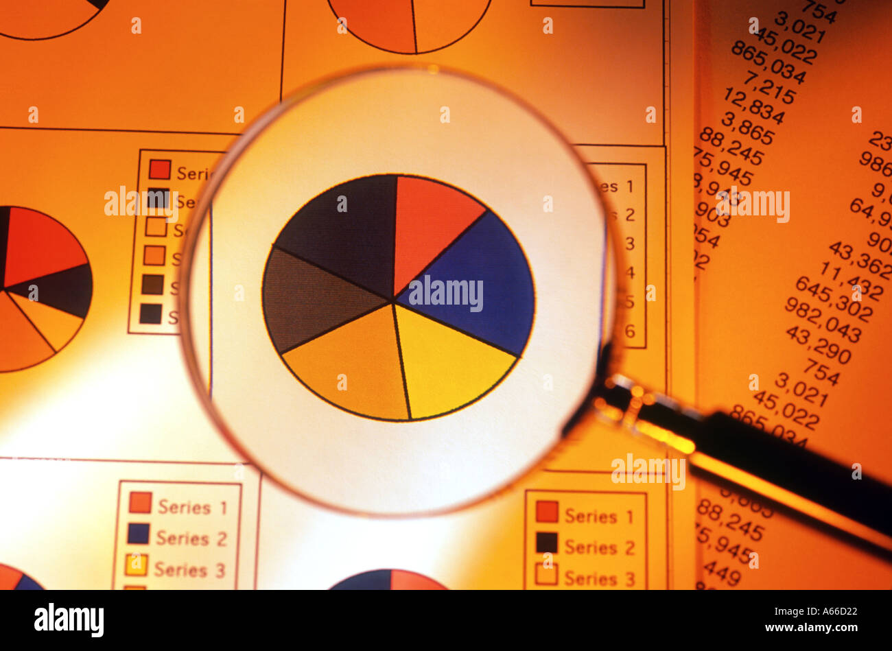 Pie chart through a magnifying glass Stock Photo - Alamy