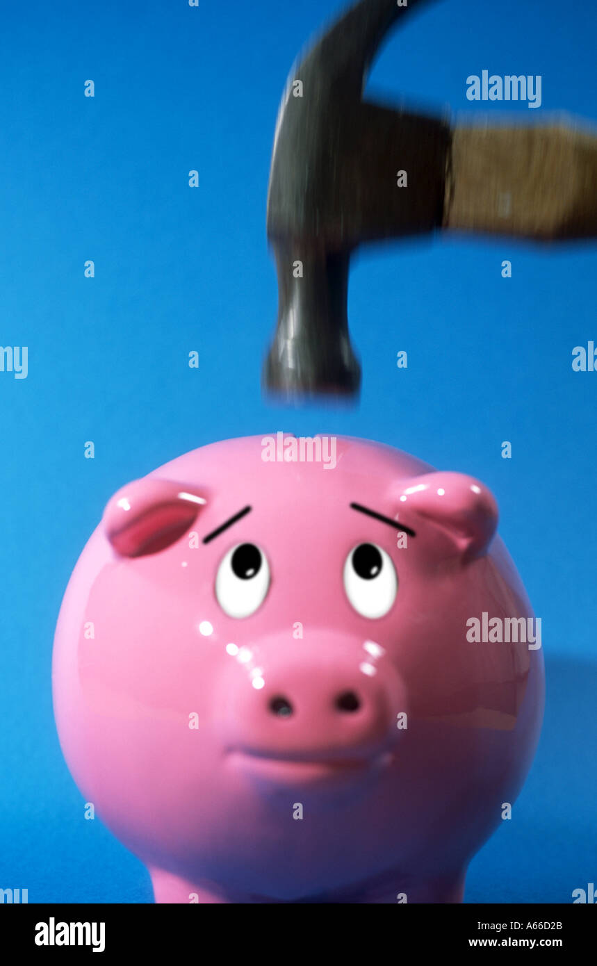 Piggy bank under the hammer Stock Photo - Alamy