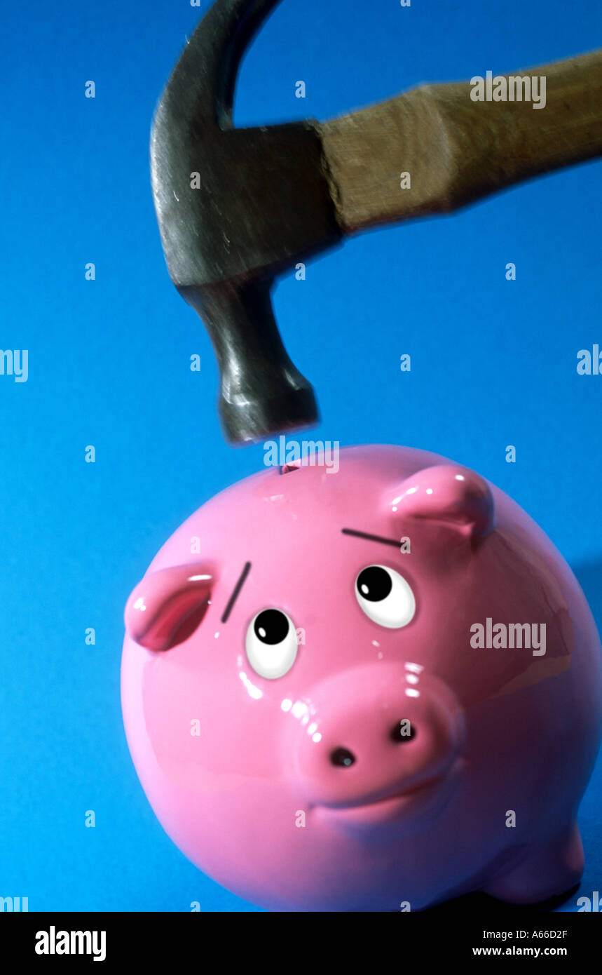 Piggy bank under the hammer Stock Photo - Alamy