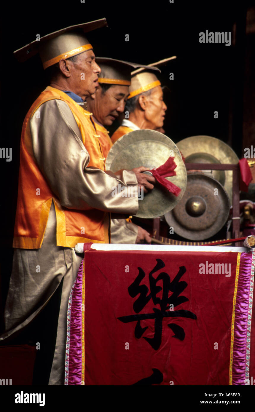 cymbal players in traditional dress playing classical Chinese