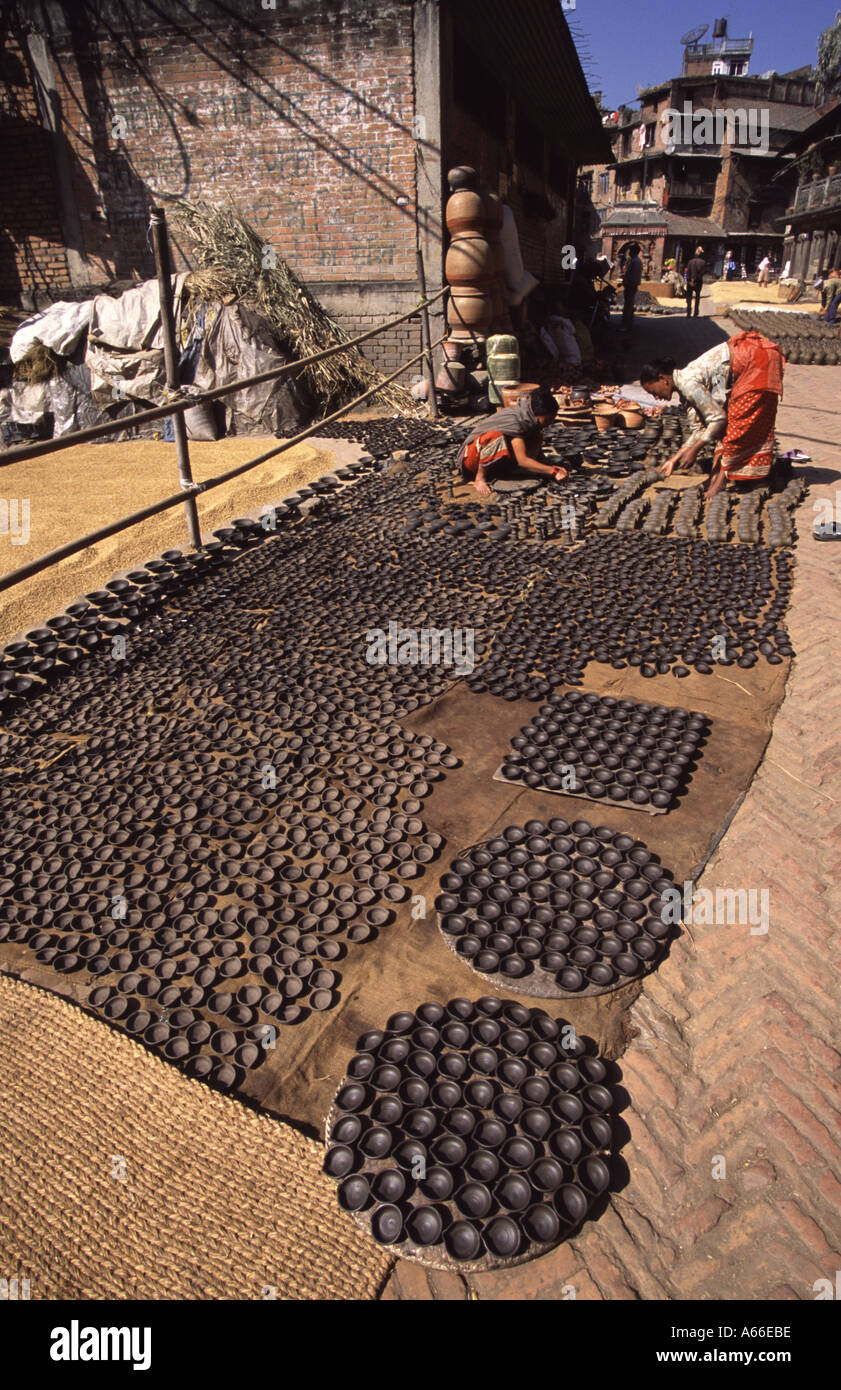 Clay pots laid out to dry in Potters Square Bhaktapur Nepal Stock Photo