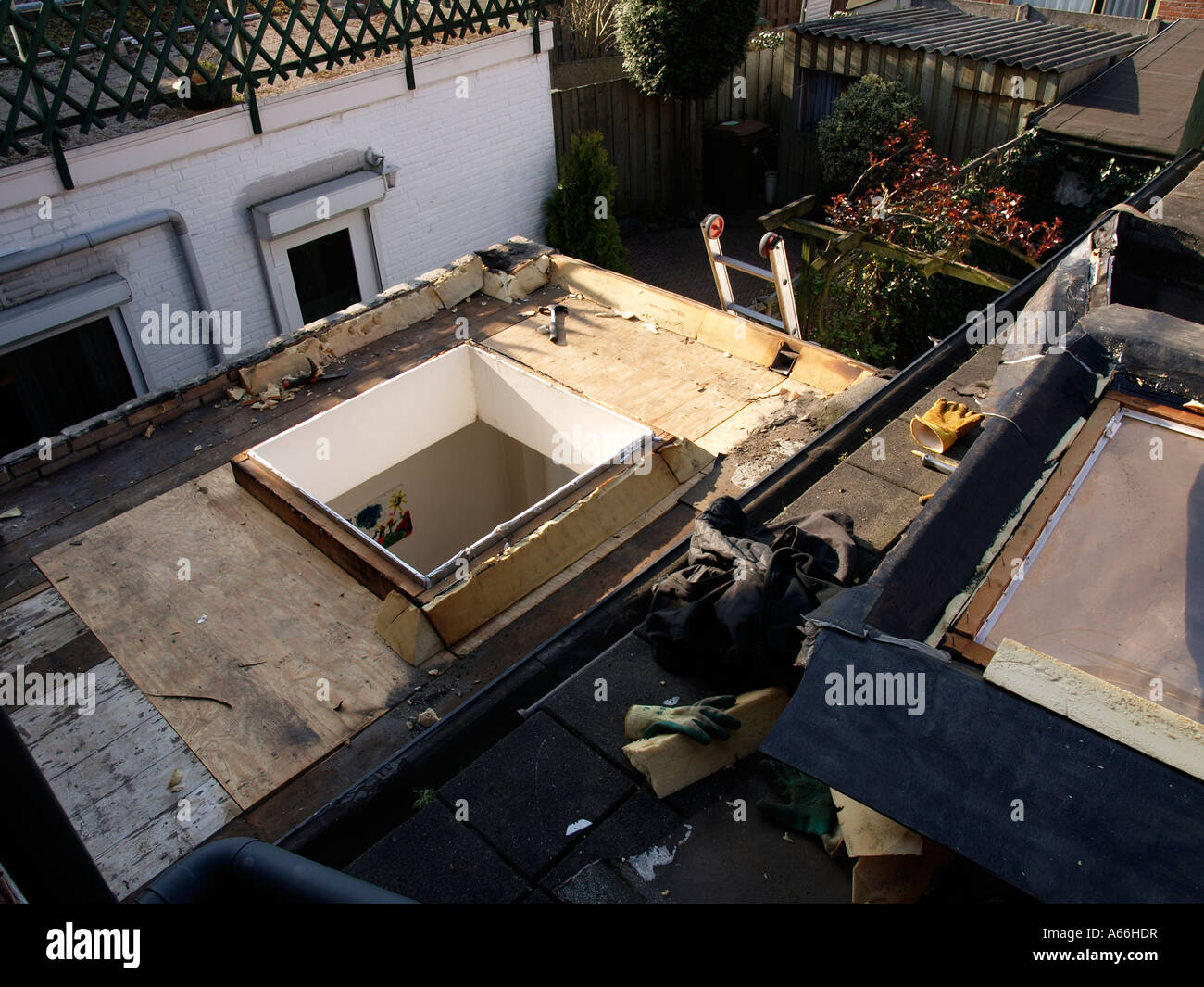 Leaking light dome skylight on a roof is being replaced repaired Breda