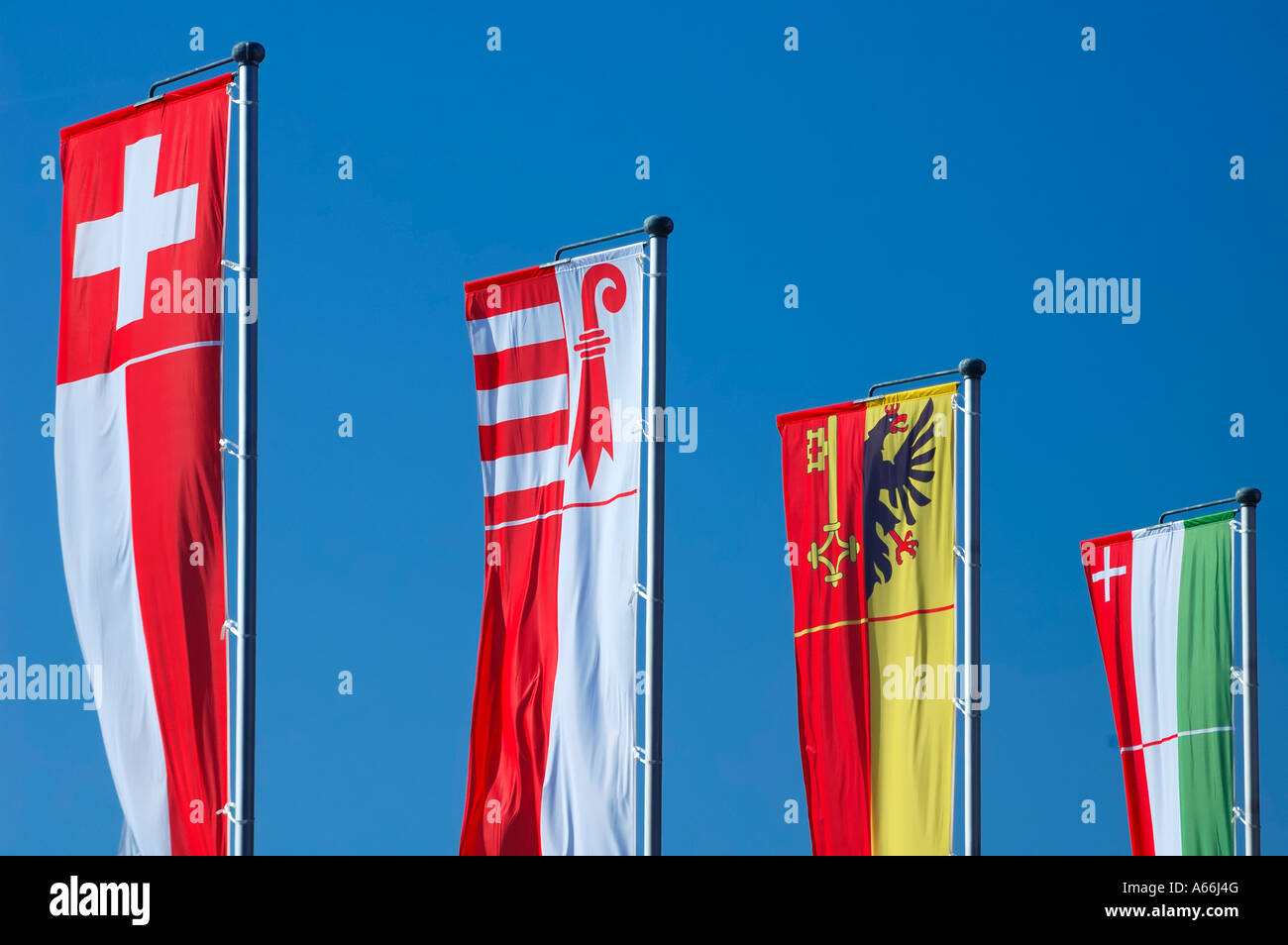 From left to right the banner of Switzerland, and the banners of the cantons of Jura Geneva and Neuchatel Stock Photo