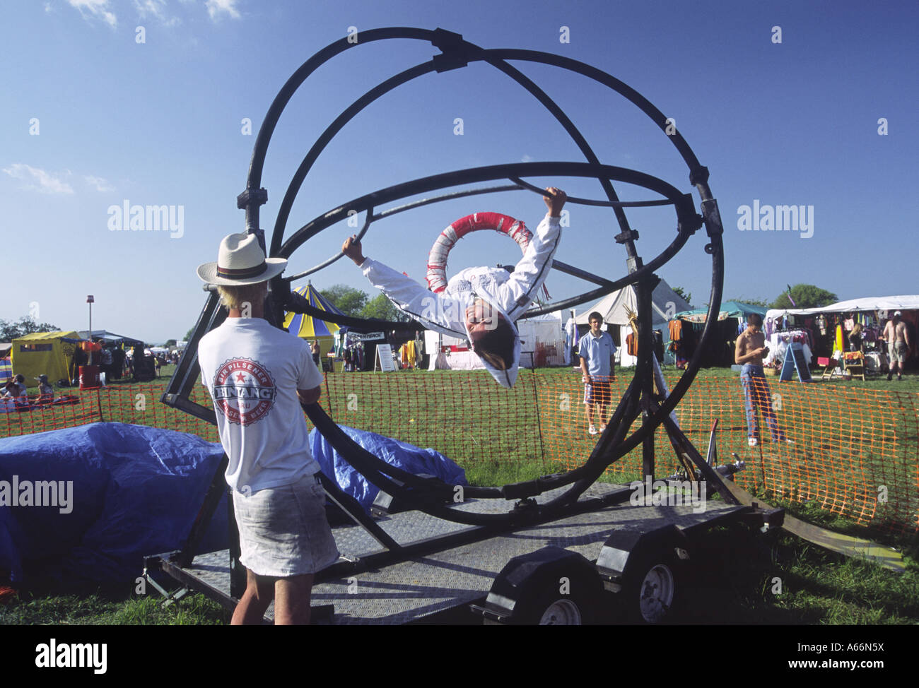 Dorset, UK 03 June 2006 Girl spinning on a human gyroscope gravity