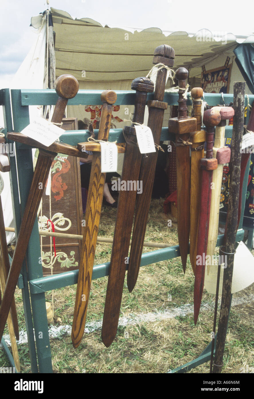 TEWKESBURY, UK - 08 July 2006 : Wooden swords displayed on a market stall on 08 July at Tewkesbury Medieval Festival, Gloucester Stock Photo