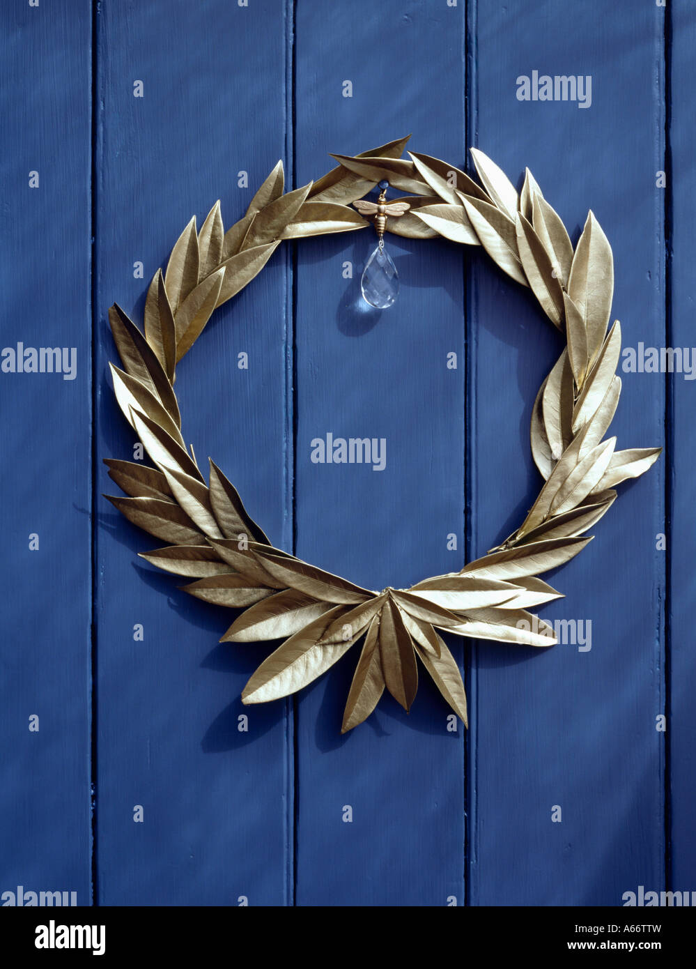 Gold laurel leaf garland on blue door Stock Photo Alamy