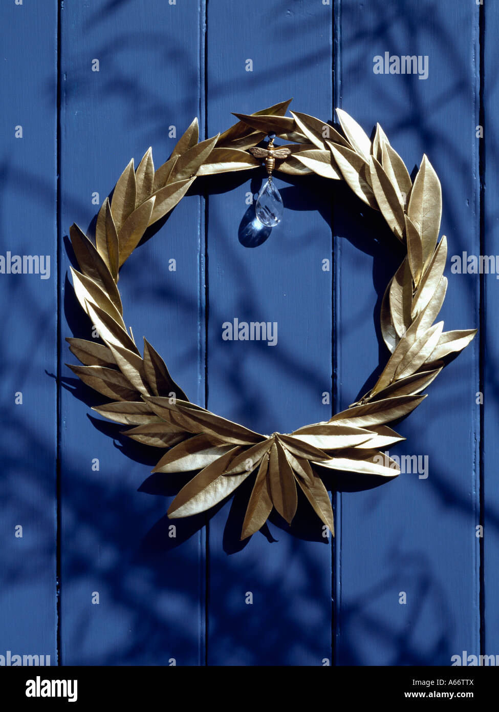 Gold laurel leaf garland on blue door Stock Photo Alamy