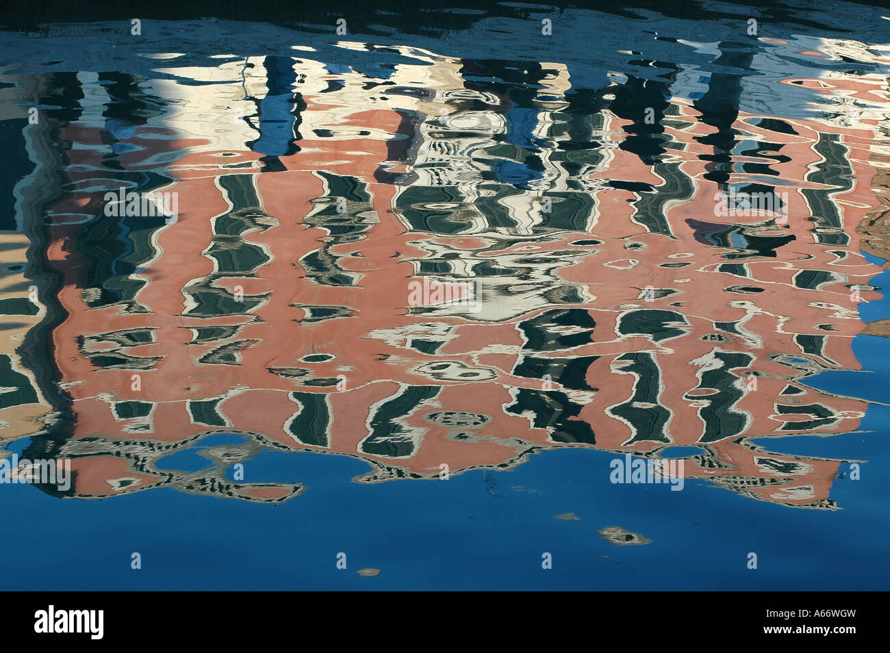 Reflection of a palace on the water in a canal of Venice Italy Stock ...