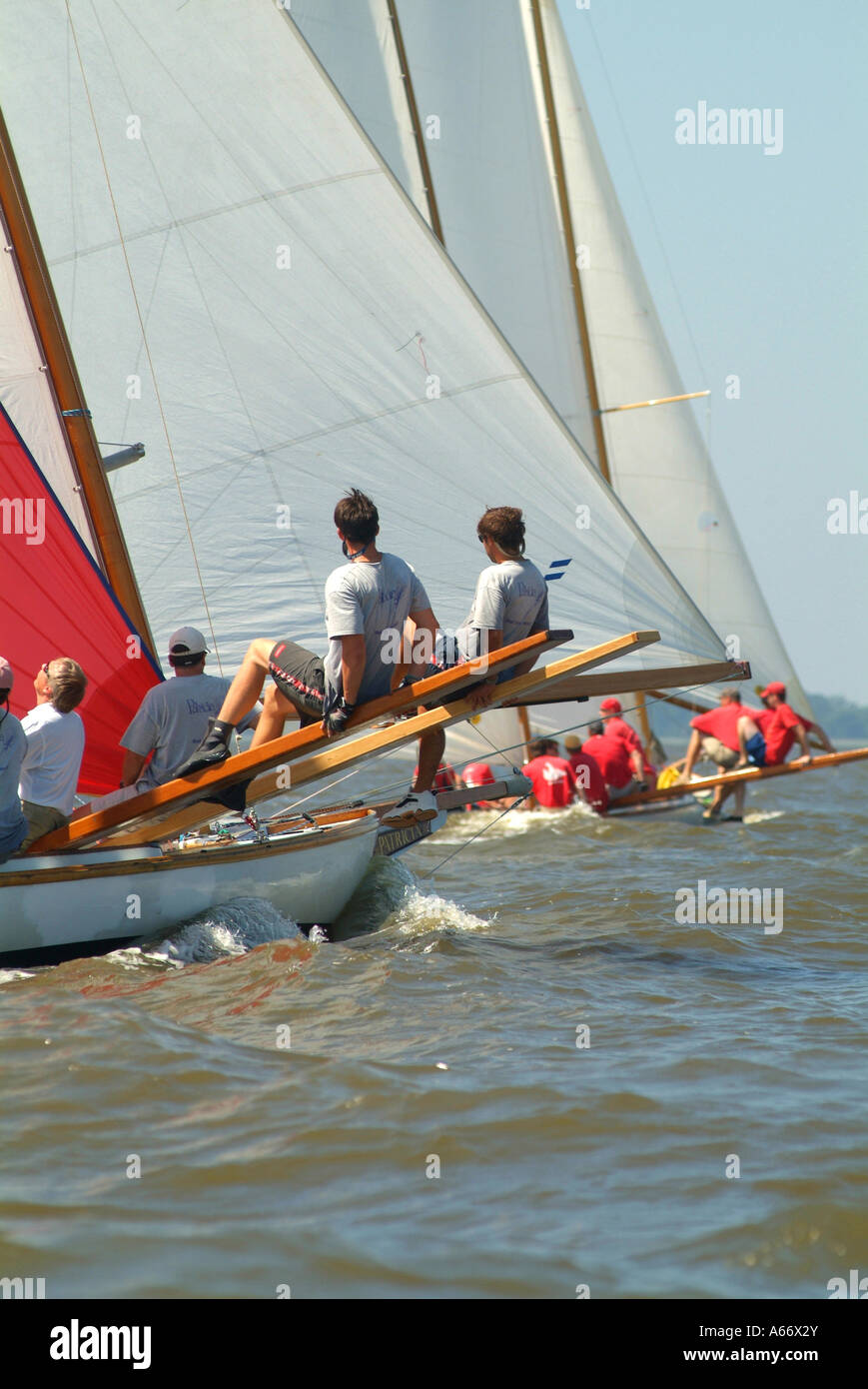 Log canoe sailboat racing on a  Chesapeake Bay region river Stock Photo