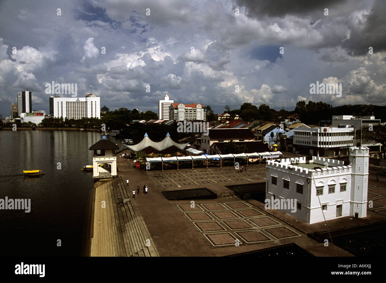 The waterfront,Kuching,Sarawak,Malaysia.Hilton Hotel in background.The square tower on right (1879) used to be a prison Stock Photo