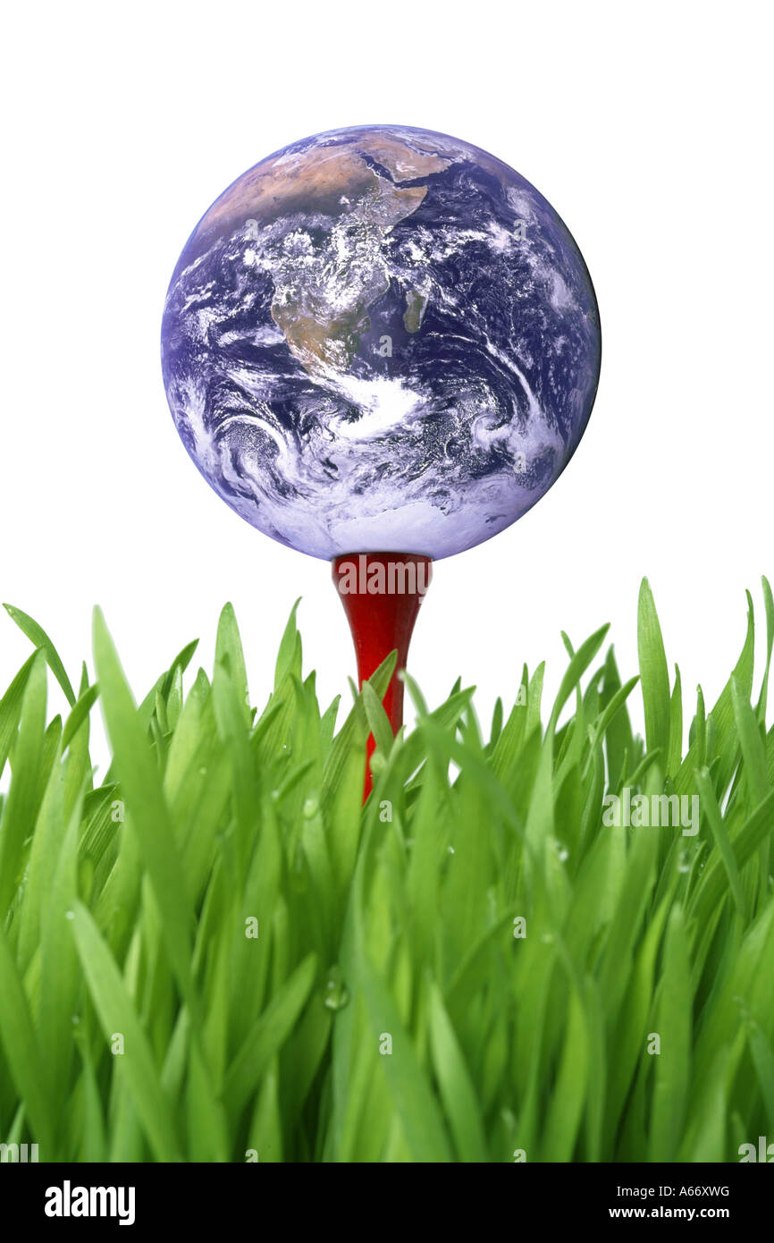 Earth on golf tee in grass Stock Photo