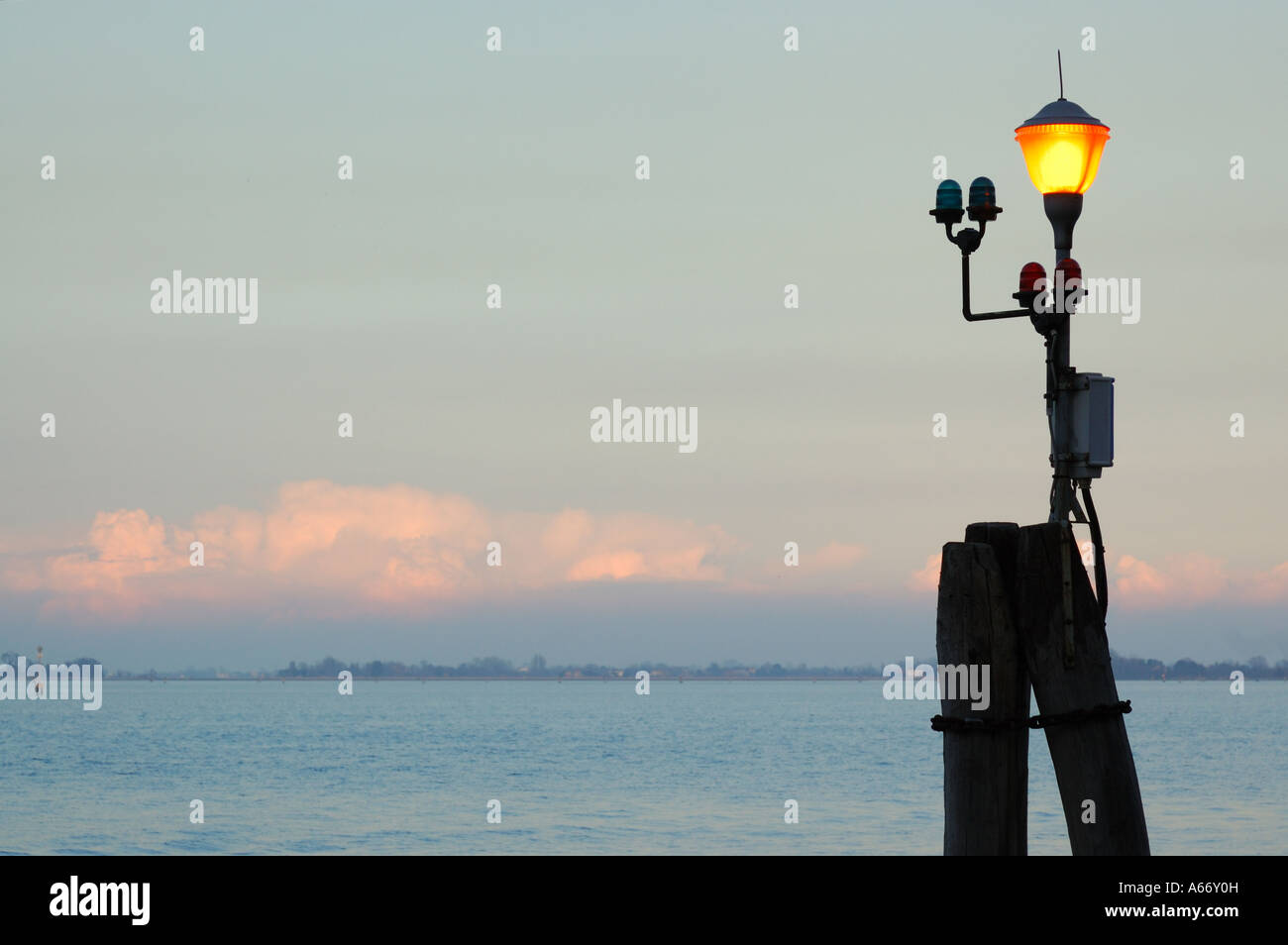 Lamppost in the lagoon of Venice Italy at sunset Stock Photo - Alamy