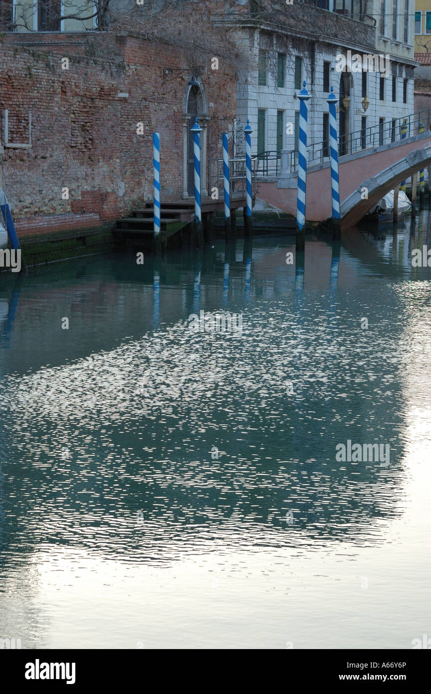 Venetian canal with bright reflections on the water Stock Photo - Alamy