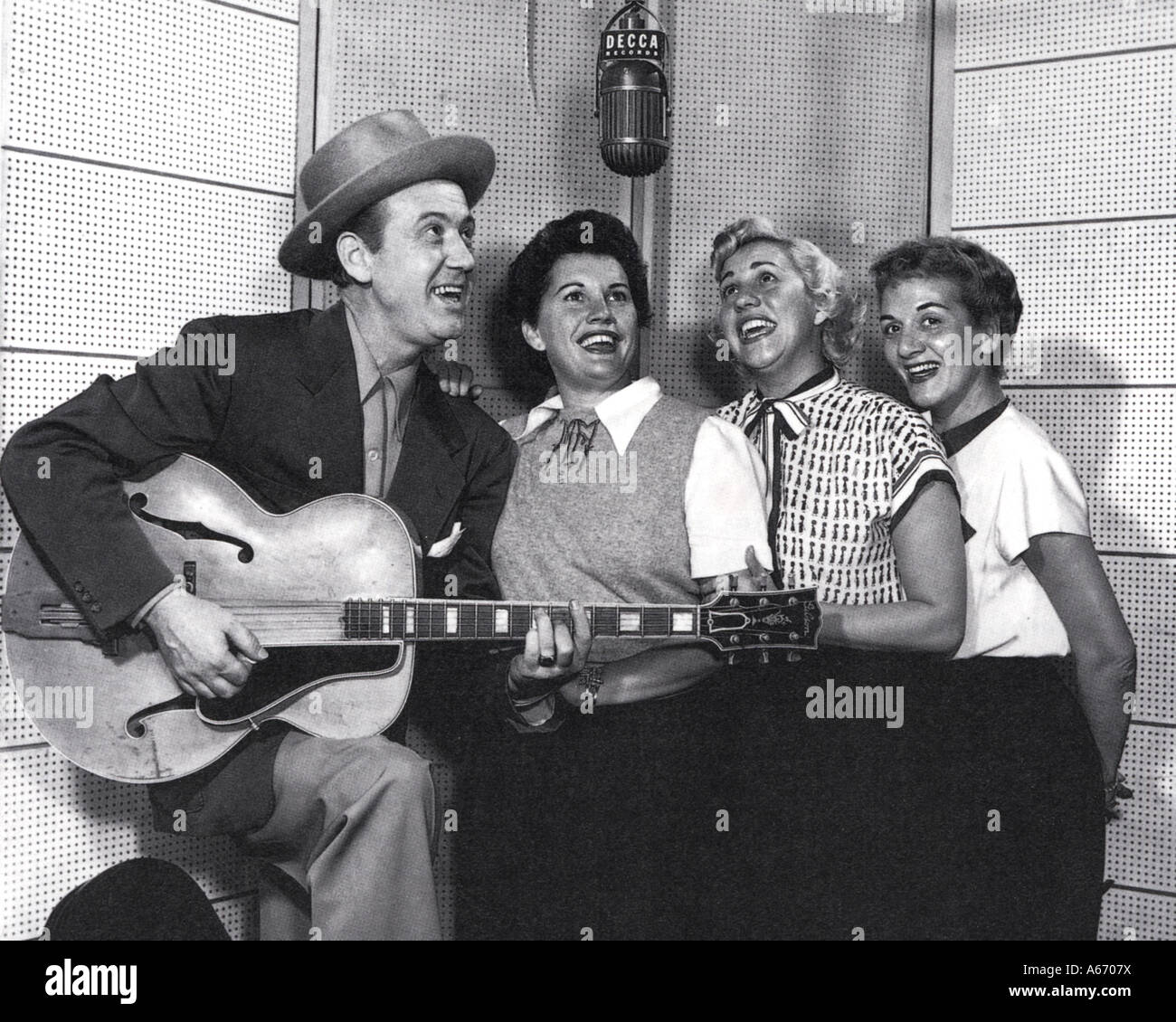 RED FOLEY US Country & Western  singer with the Andrews Sisters about 1952 from l: Maxene, Patti and LaVerne Stock Photo
