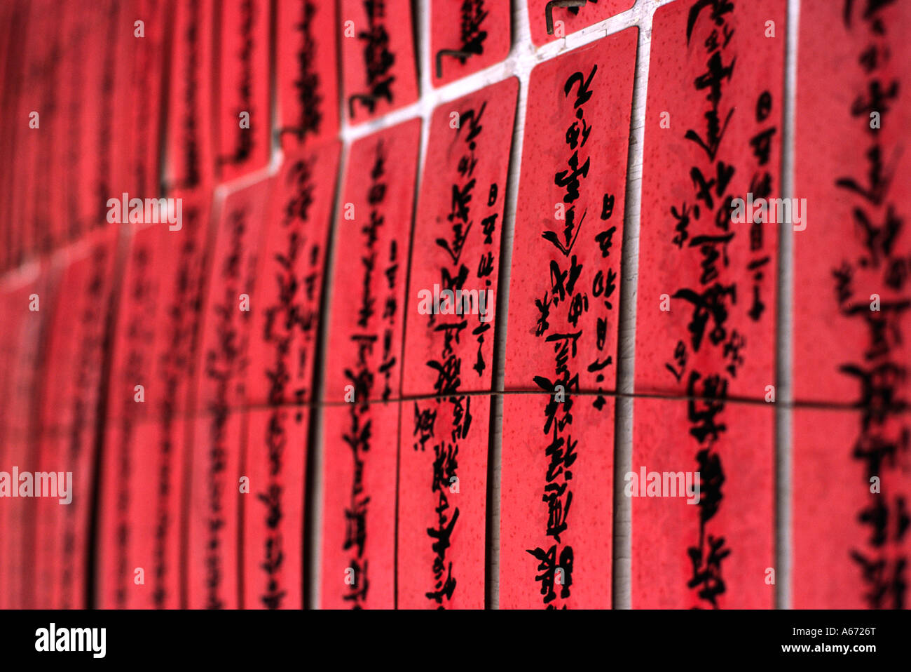 Prayer slips decorate a wall in the Chuk Lam Sim Bamboo Forest Monastery at Tsuen Wan in the New Territories Hong Kong Stock Photo