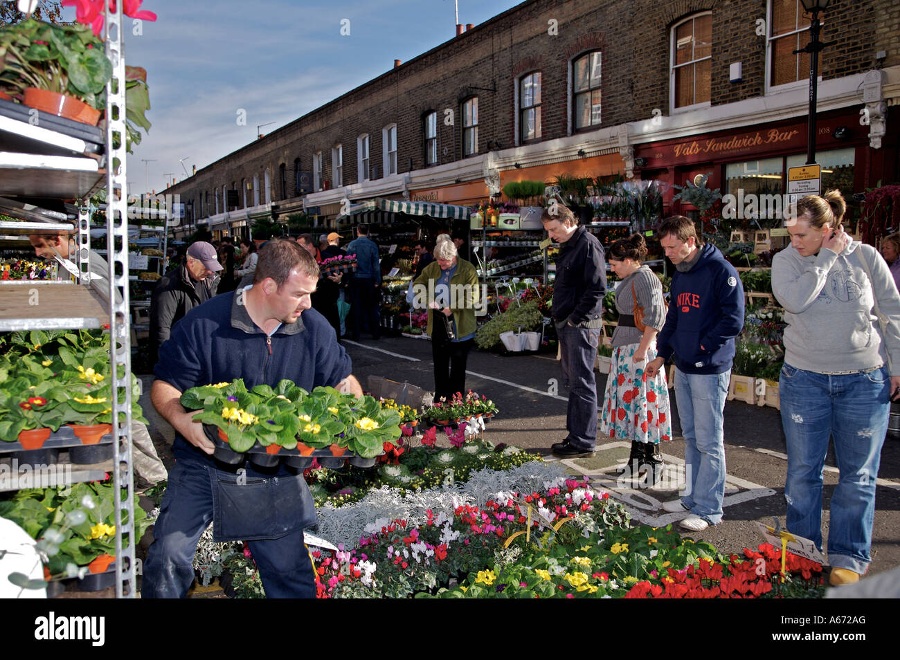 Every Sunday locals flock to the Columbia Road flower market in Hackney North East London Stock Photo